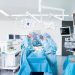 Surgical team performing a minimally invasive proctology procedure in a modern UAE operating theatre